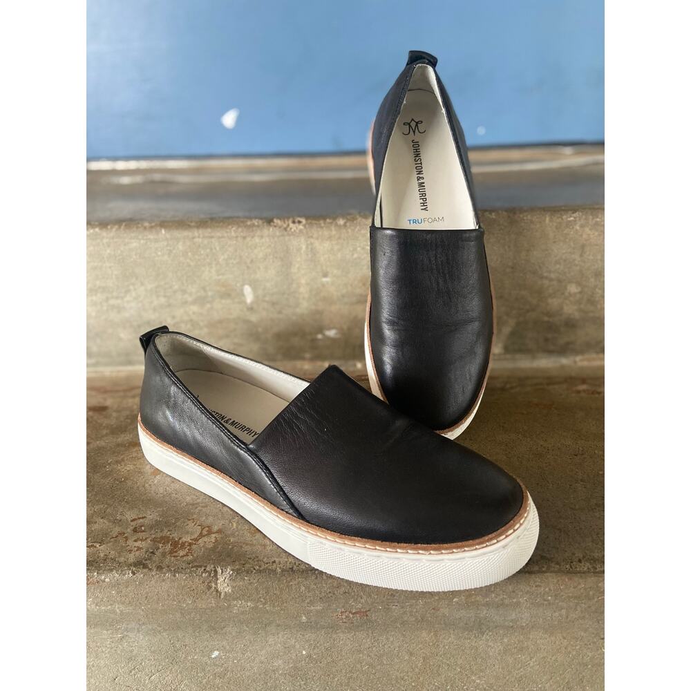 Johnston & Murphy black leather loafer style slip on sneaker with white outsole